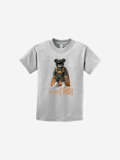 A light gray youth essential t-shirt featuring the ['ro] graphic bear design with "Go Like ['RO]" in bold lettering. Made for comfort and everyday adventures.