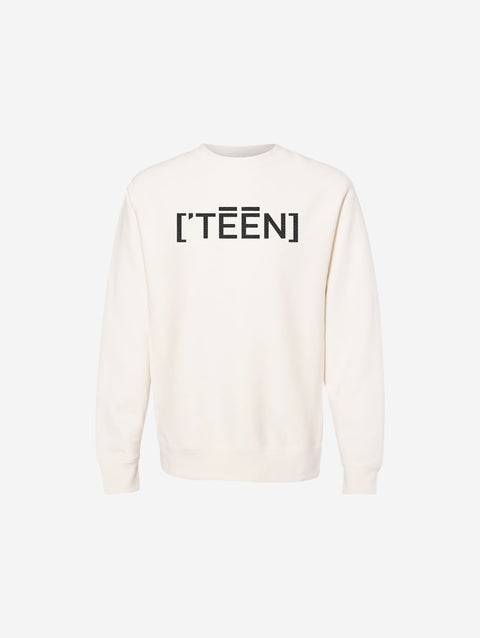 A neutral bone-colored cross-grain crewneck sweatshirt with the ['TEEN] logo in a bold dark font, offering a warm and understated look.