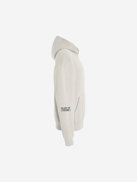 A bone-colored off-white hoodie with the bold text "[‘TĒĒN]" in black, minimalist design, featuring a pullover style.