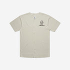 A classic bone-colored baseball jersey with the 'Lil Hū' logo on the chest, delivering a clean and timeless look with a sporty edge.