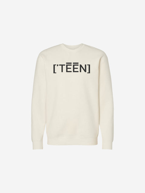 A bone colored crewneck sweatshirt designed with the ['TEEN] logo in black for a classic and casual everyday look.