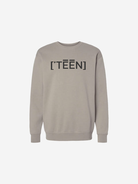 A cement crewneck sweatshirt featuring the sleek ['TEEN] branding in black. Effortlessly blends earthy tones with a modern design.