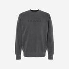 Pigment-dyed crewneck sweatshirt in black featuring a minimalistic 'HŪMN' logo, offering a stylish and vintage-inspired look with a soft, lived-in feel.