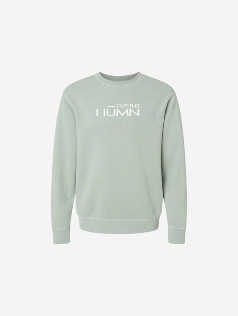 A serene sage green pigment-dyed crewneck sweatshirt featuring the refined 'FLIP THE HŪMN' logo. A calm and versatile option for all seasons.