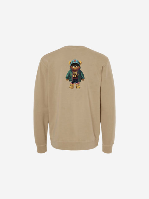 A soft sandstone pigment-dyed crewneck sweatshirt showcasing the sleek 'FLIP THE HŪMN' logo. A neutral tone ideal for layering or lounging.