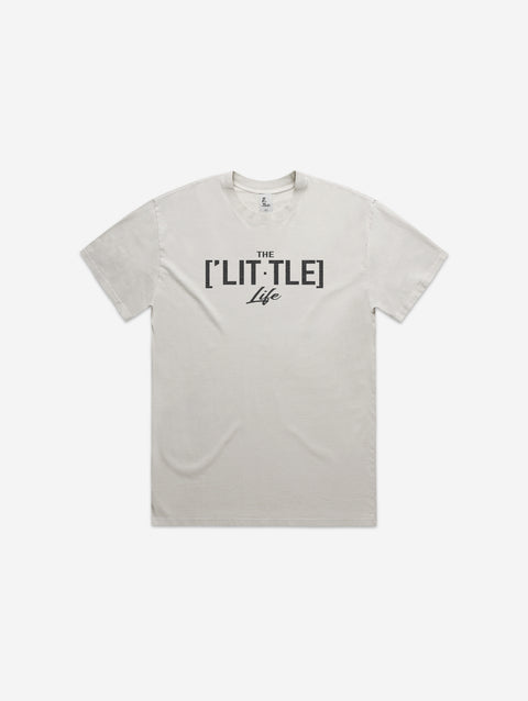 Bone-colored heavy faded tee with '[LIT·TLE] Life' printed on the chest, featuring a relaxed fit and minimalist design.