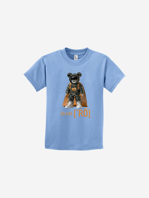 A pastel blue youth t-shirt adorned with the ['ro] bear design and motivational "Go Like ['RO]" slogan. Soft and approachable.
