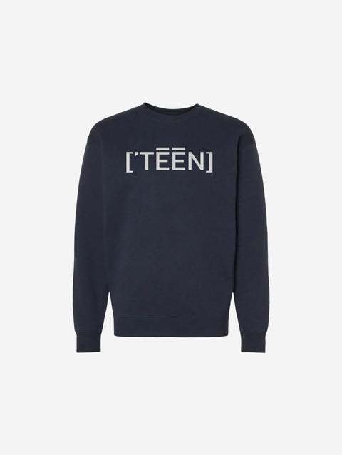A navy blue crewneck sweatshirt featuring the bold and minimalistic ['TEEN] design in a striking light-colored font across the chest. Perfect for a clean, modern look.