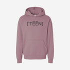 A rose-colored orchid pink hoodie with the bold text "[‘TĒĒN]" in black, minimalist design, featuring a pullover style.