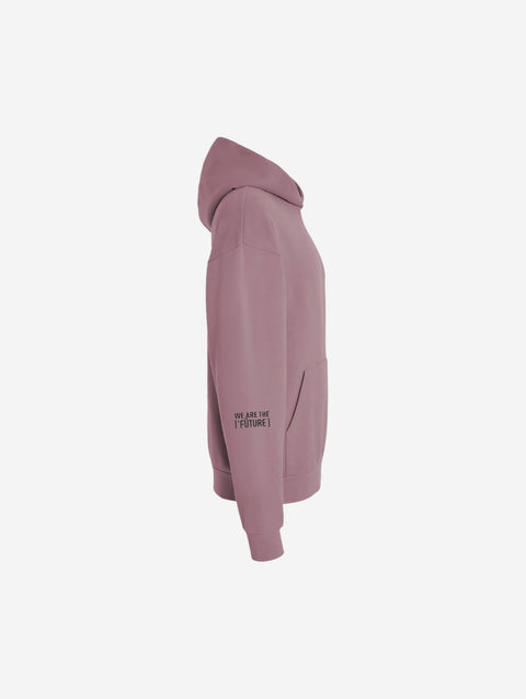 A rose-colored orchid pink hoodie with the bold text "[‘TĒĒN]" in black, minimalist design, featuring a pullover style.