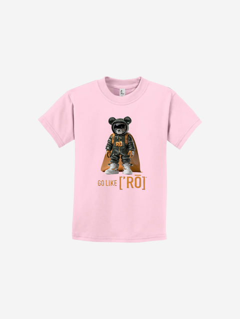 A soft pink youth essential t-shirt showcasing the ['ro] bear graphic and "Go Like ['RO]" text, blending playful style with functionality.