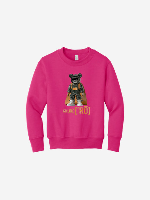 Bright pink youth fleece sweatshirt featuring the iconic ['RŌ] bear design with a cape, perfect for vibrant, bold style and cozy comfort.