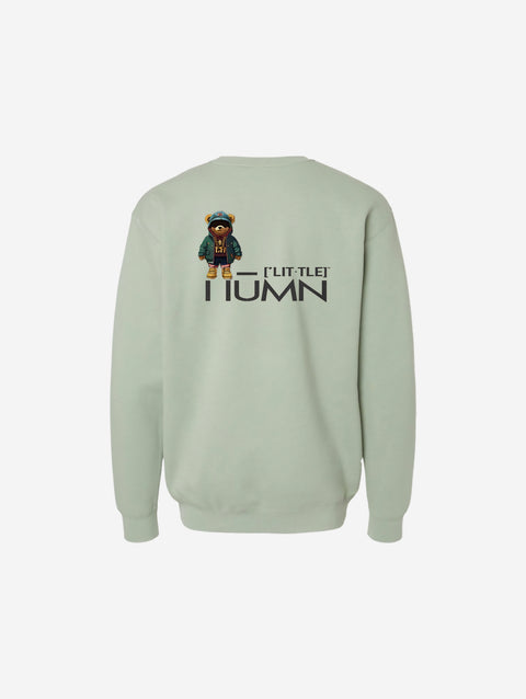 A muted sage green crewneck sweatshirt with the minimalist ['TEEN] logo in black, creating a calm and contemporary vibe.