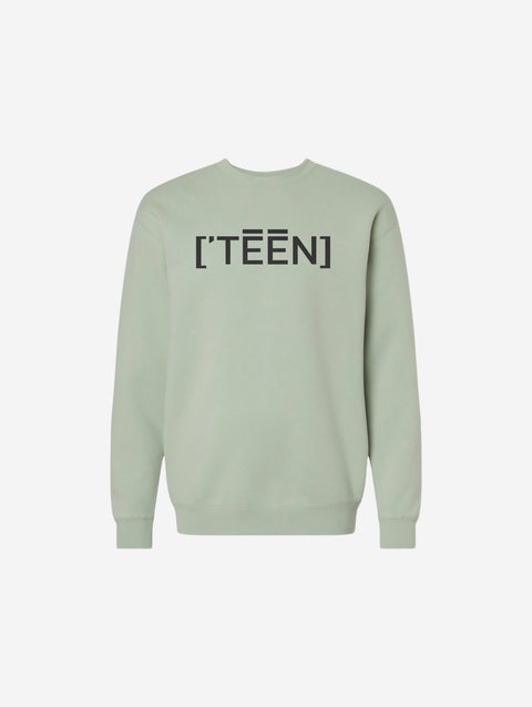 A muted sage green crewneck sweatshirt with the minimalist ['TEEN] logo in black, creating a calm and contemporary vibe.