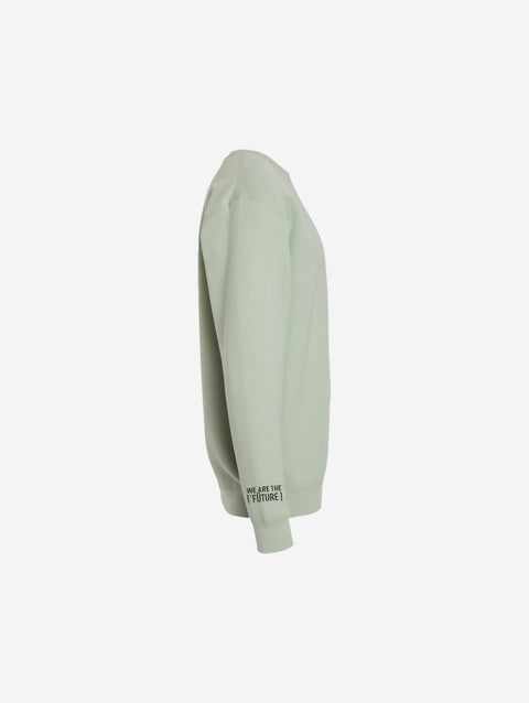 A muted sage green crewneck sweatshirt with the minimalist ['TEEN] logo in black, creating a calm and contemporary vibe.