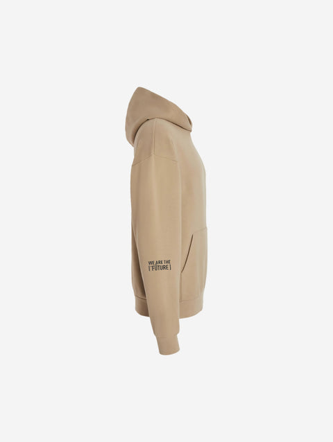 A beige-colored sandstone hoodie with the bold text "[‘TĒĒN]" in black, minimalist design, featuring a pullover style.