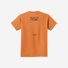 A warm sherbet orange youth essential tee with the ['LIT·TLE] HŪMN bear, blending earthy tones and comfort.