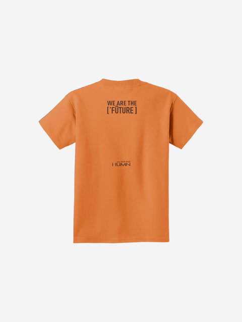 A warm sherbet orange youth essential tee with the ['LIT·TLE] HŪMN bear, blending earthy tones and comfort.
