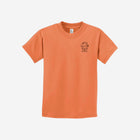 A warm sherbet orange youth essential tee with the ['LIT·TLE] HŪMN bear, blending earthy tones and comfort.