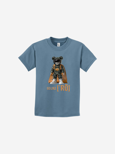 A muted blue youth t-shirt featuring the ['ro] bear graphic and "Go Like ['RO]" text for a relaxed, stylish vibe.