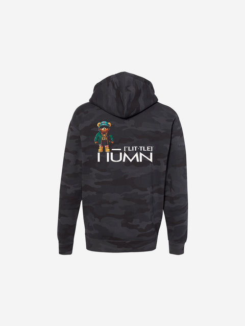A black camouflage print hoodie with the text "[‘TEEN]" printed in bold white lettering across the chest. The design blends subtle camo tones with a sleek streetwear aesthetic.