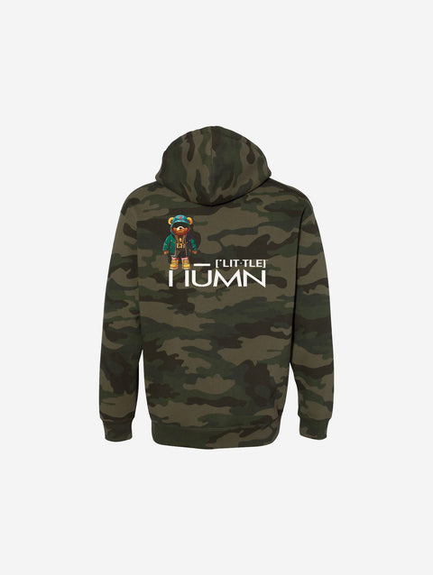 A green and brown camouflage print hoodie featuring "[‘TEEN]" in bold white lettering on the front. The hoodie combines rugged outdoor vibes with a modern streetwear style.