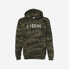 A green and brown camouflage print hoodie featuring "[‘TEEN]" in bold white lettering on the front. The hoodie combines rugged outdoor vibes with a modern streetwear style.