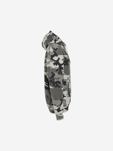 A gray and white snow camouflage print hoodie with "[‘TEEN]" printed in bold white text across the chest. This hoodie showcases a striking pattern perfect for a cool, edgy look.