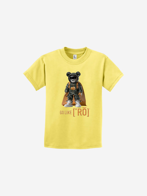 A light pastel yellow youth t-shirt featuring the ['ro] bear artwork and motivational "Go Like ['RO]" logo, ideal for a cheerful aesthetic.